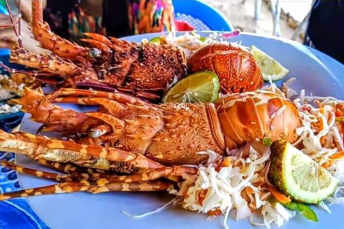 Grilled lobster served on a table during Wasini Island seafood feast